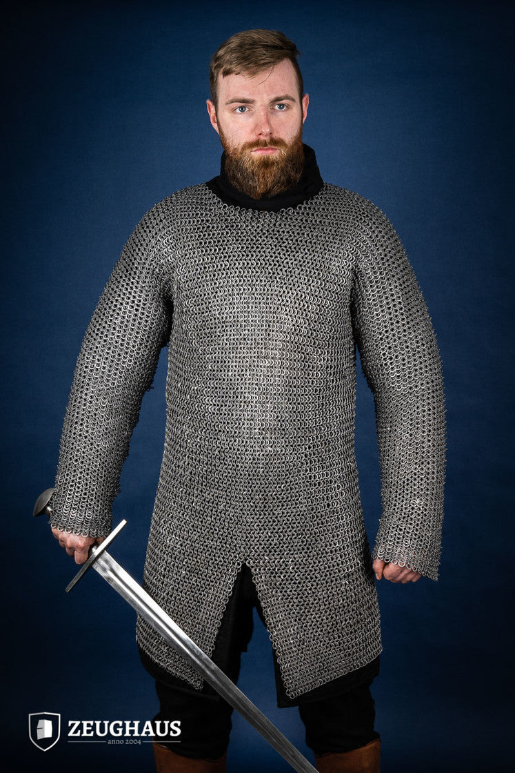 Chainmail Hauberk made of 9mm steel with wedge riveted design, featuring a natural oiled finish, showcasing its durability and classic European style.