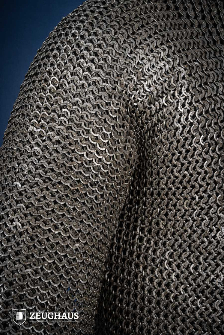 Chainmail Hauberk made of 9mm steel with wedge riveted design, featuring a natural oiled finish, showcasing its durability and classic European style.