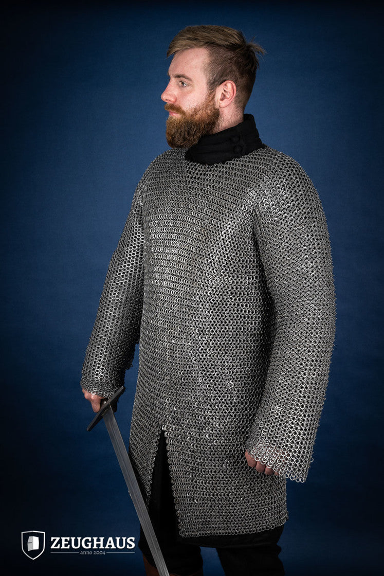 Chainmail Hauberk made of 9mm steel with wedge riveted design, featuring a natural oiled finish, showcasing its durability and classic European style.