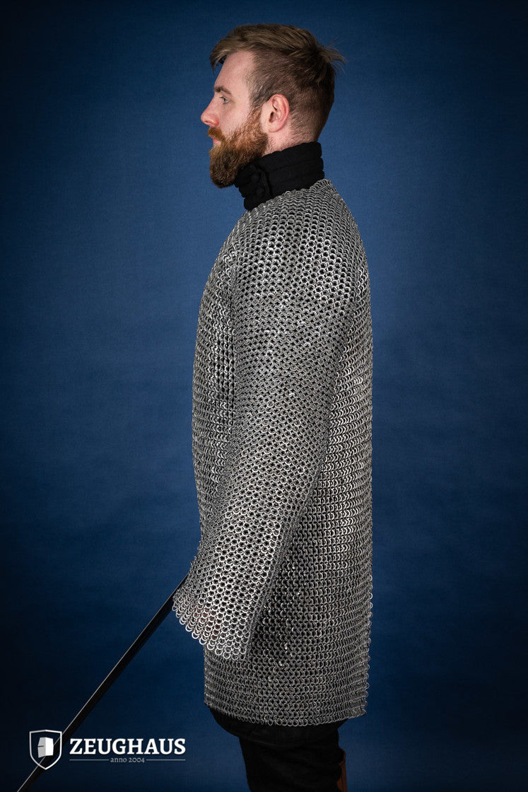 Chainmail Hauberk made of 9mm steel with wedge riveted design, featuring a natural oiled finish, showcasing its durability and classic European style.