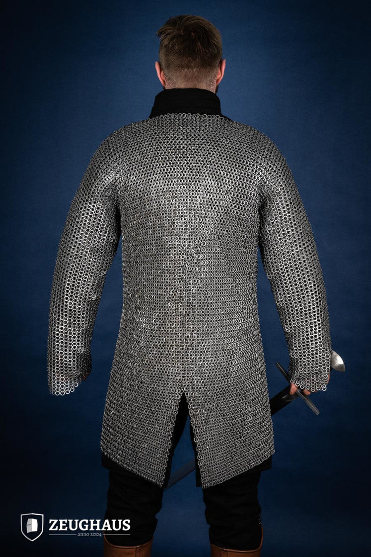 Chainmail Hauberk made of 9mm steel with wedge riveted design, featuring a natural oiled finish, showcasing its durability and classic European style.