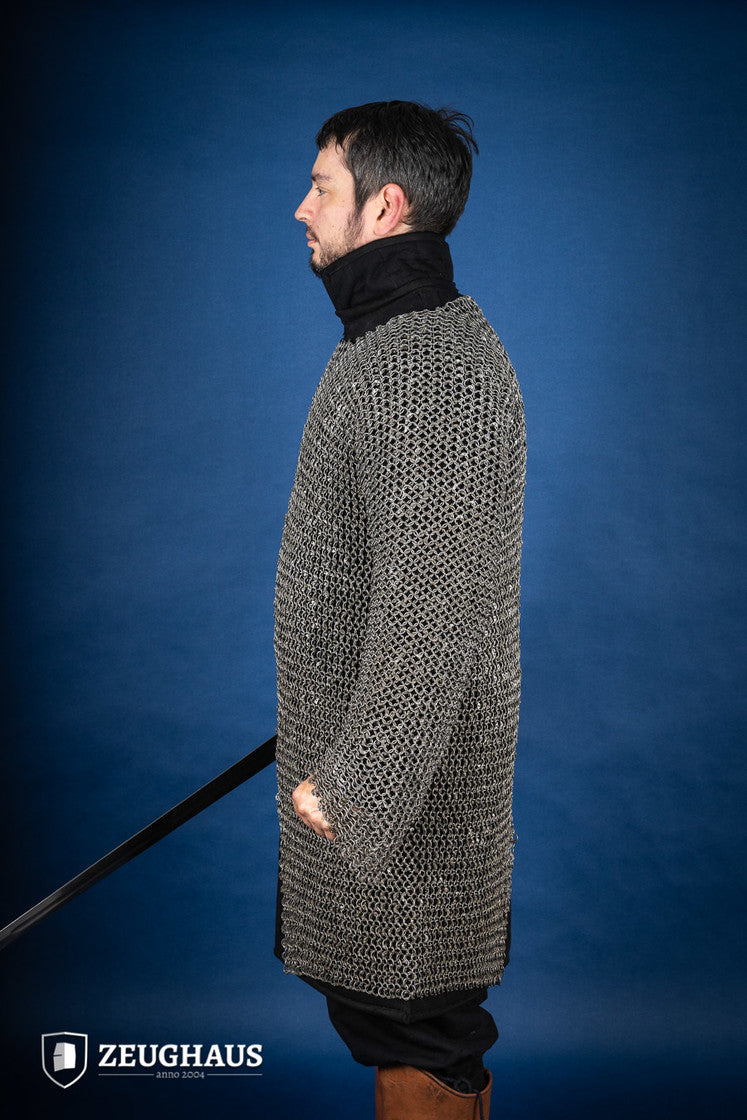 Chainmail Hauberk made of riveted 10mm steel rings, featuring a natural oiled finish, showcasing its intricate European 4-in-1 braid design.