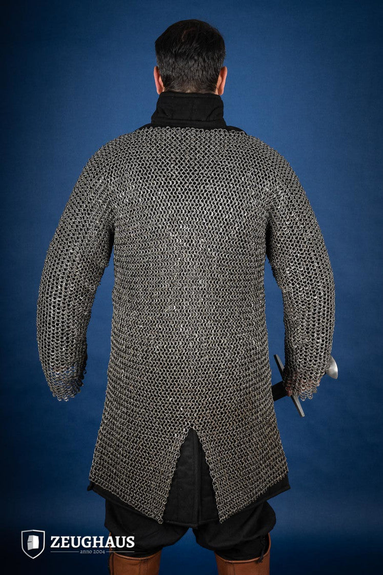 Chainmail Hauberk made of riveted 10mm steel rings, featuring a natural oiled finish, showcasing its intricate European 4-in-1 braid design.