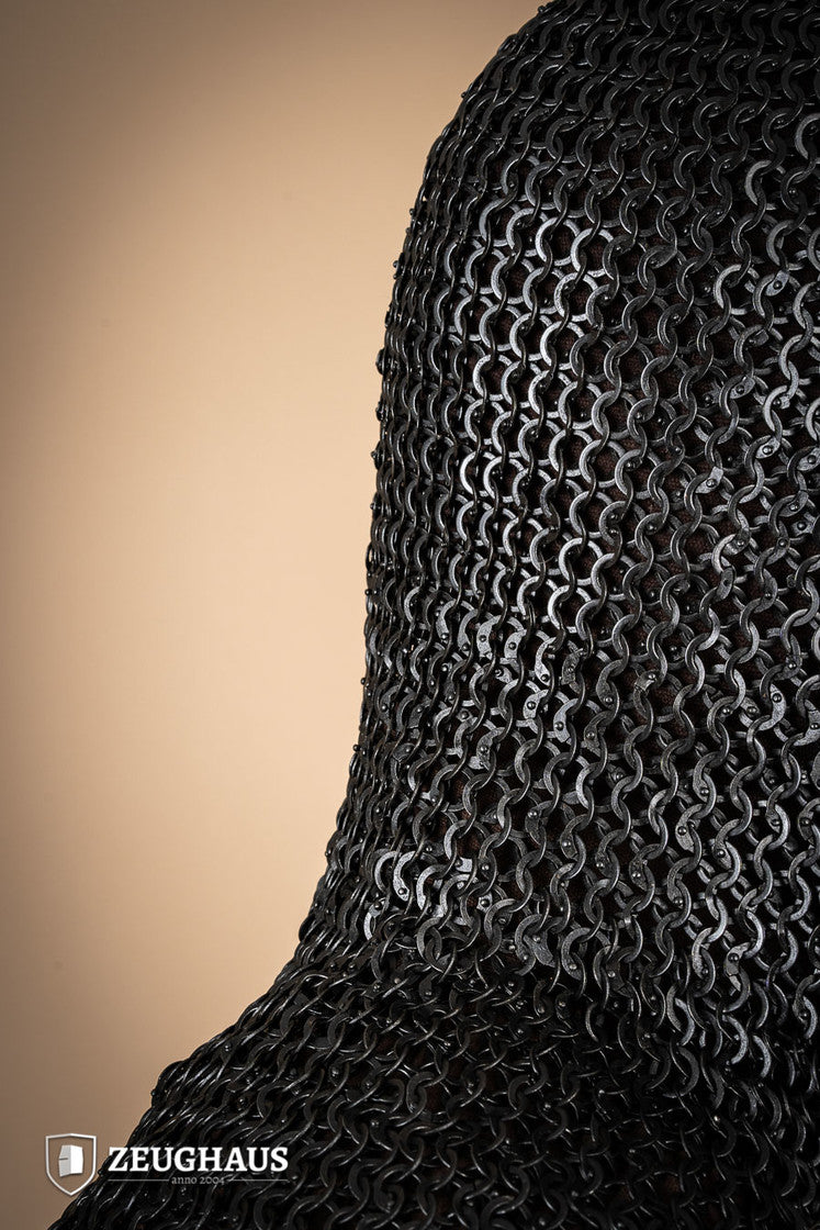 A detailed view of a burnished chainmail hood made from mild steel, featuring flat rings and a unique riveting pattern.