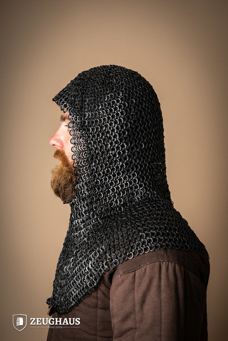 A detailed view of a burnished chainmail hood made from mild steel, featuring flat rings and a unique riveting pattern.