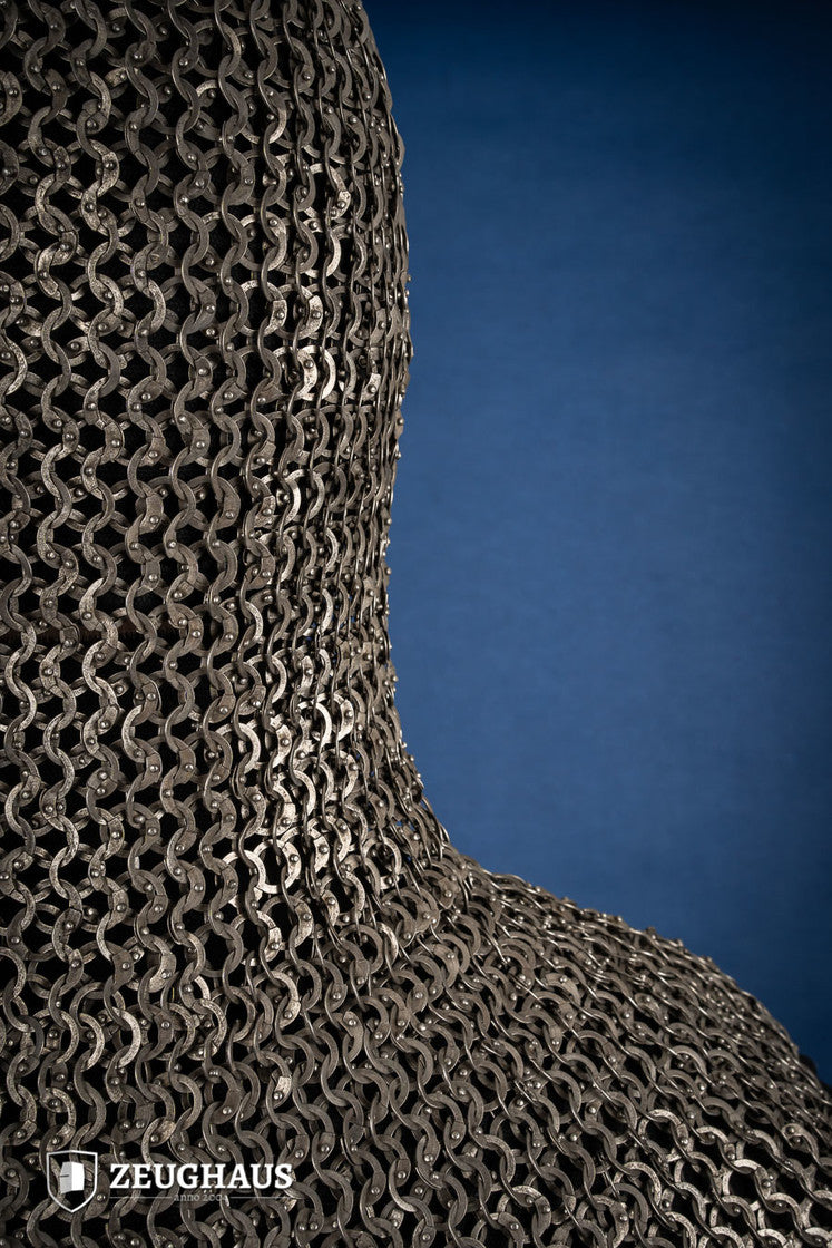 A detailed view of a Chainmail Hood made from 9mm stainless steel with a natural oiled finish, showcasing riveted flat rings in a European 4-in-1 braid pattern.