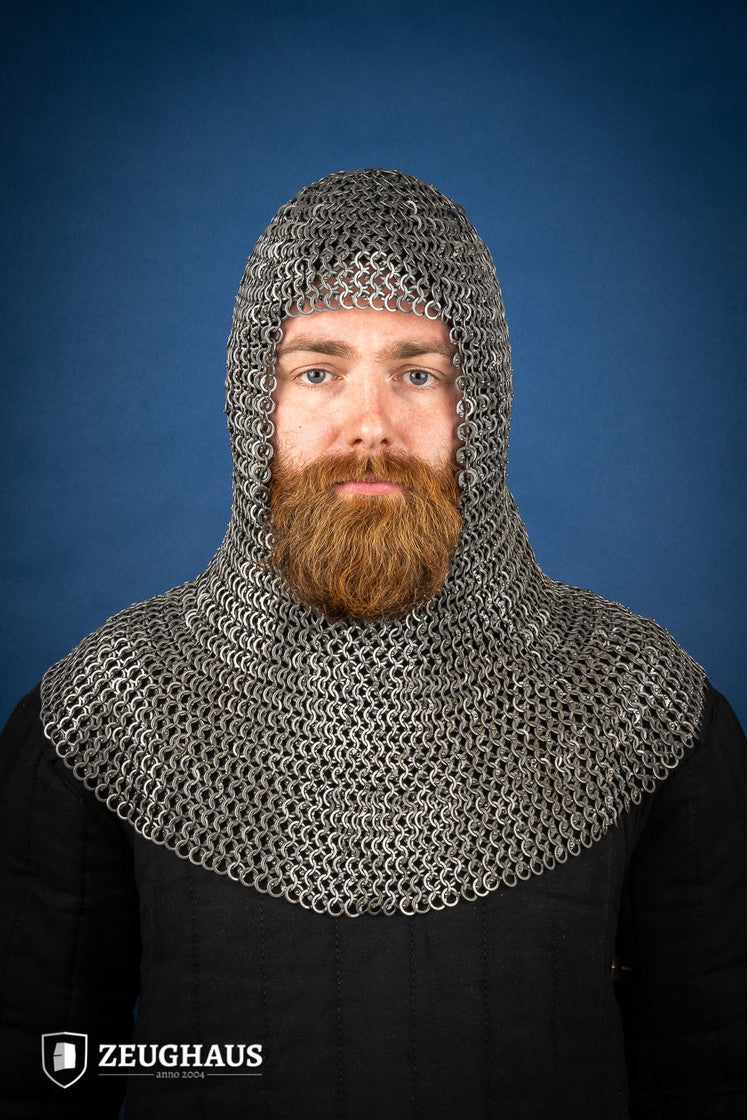 Chainmail hood made of 9mm oiled mild steel with flat rings, featuring wedge riveted construction and European 4-in-1 braid design.