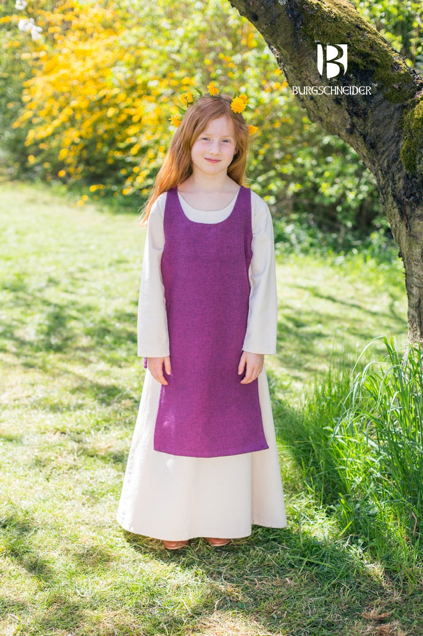 Children's Over Dress Ylva in Lilac, featuring adjustable fabric ties and durable cotton fabric, perfect for active play.