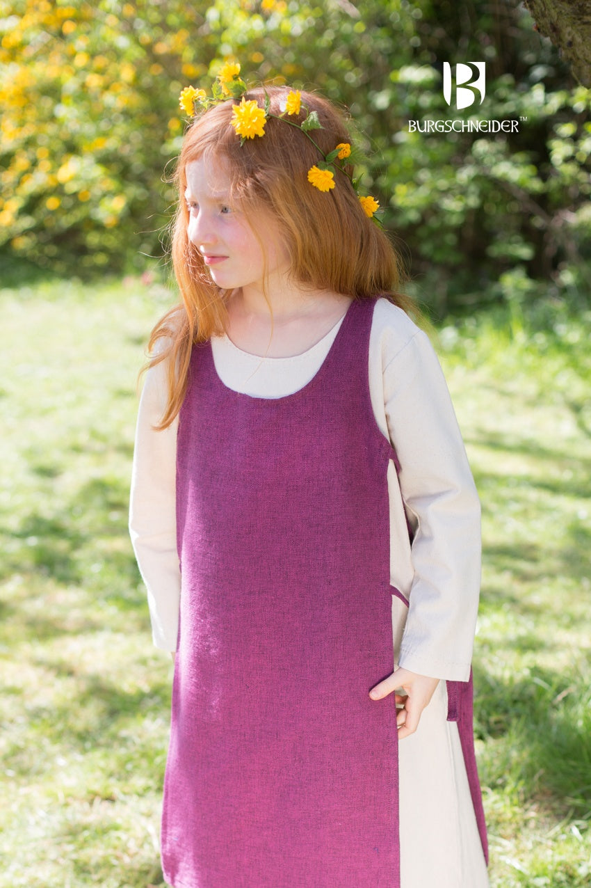 Children's Over Dress Ylva in Lilac, featuring adjustable fabric ties and durable cotton fabric, perfect for active play.