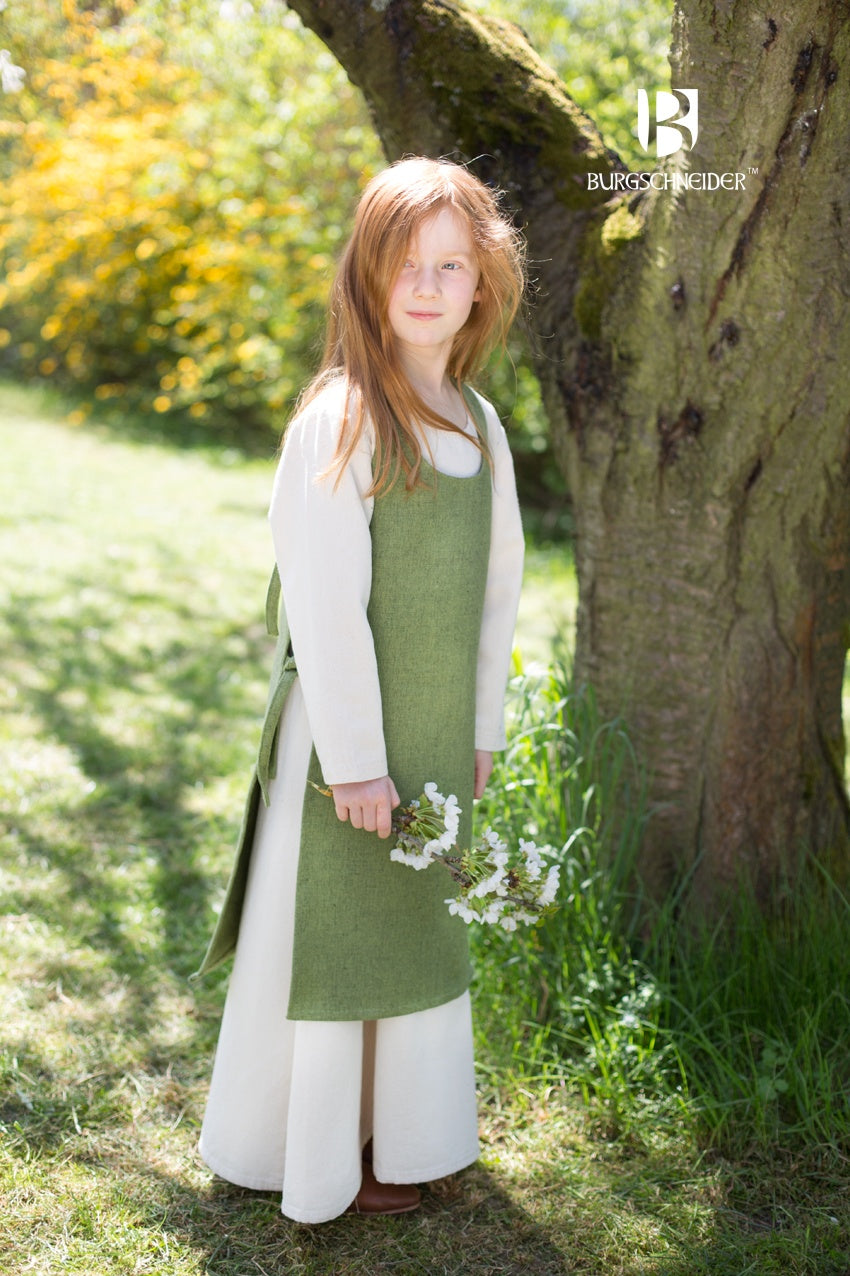 Children's Over Dress Ylva in Linden Green, featuring fabric ties and durable cotton material, perfect for active kids.