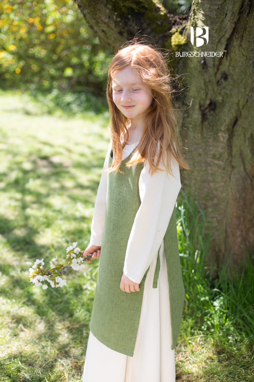 Children's Over Dress Ylva in Linden Green, featuring fabric ties and durable cotton material, perfect for active kids.