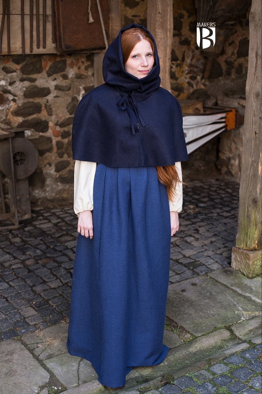 Cowl Curt Dark Blue gugel, featuring a snug fit over shoulders, adjustable neck straps, and a roll-out headpiece for cold weather protection.