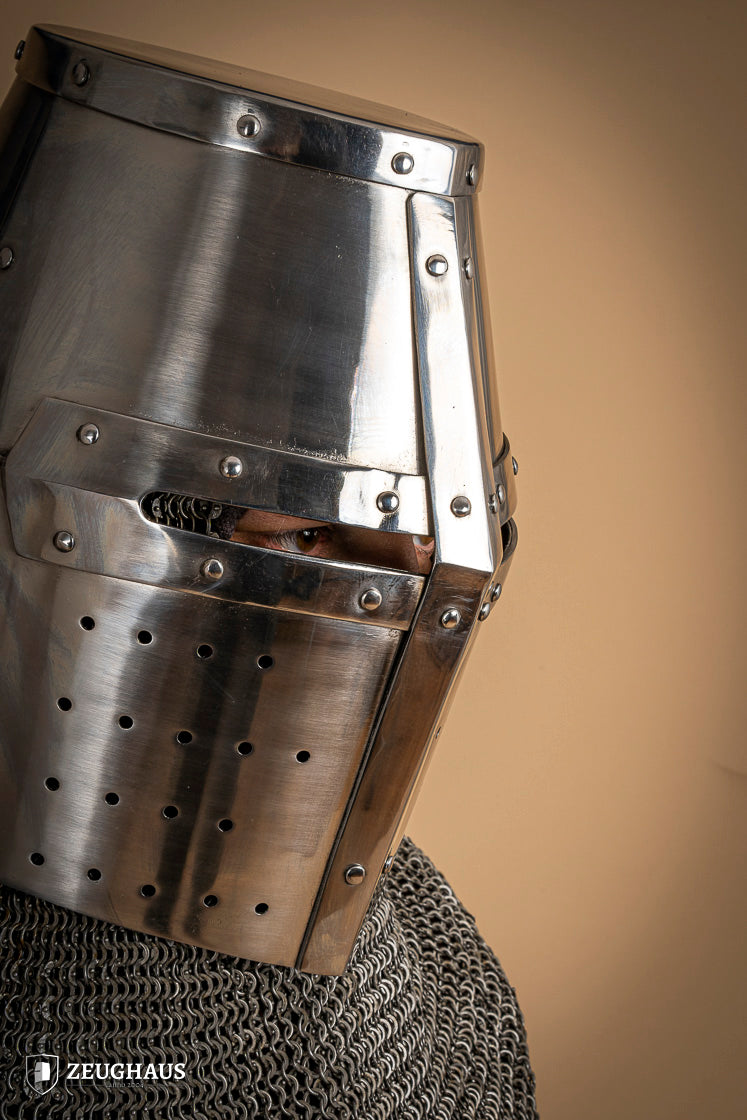 Crusader Great Helmet made of 1.6mm polished steel with a fixed visor and leather chin strap, showcasing medieval craftsmanship.