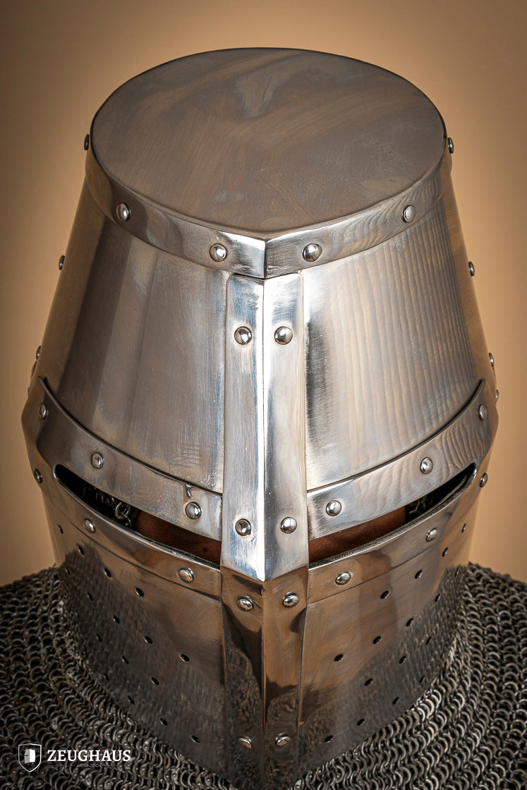 Crusader Great Helmet made of 1.6mm polished steel with a fixed visor and leather chin strap, showcasing medieval craftsmanship.