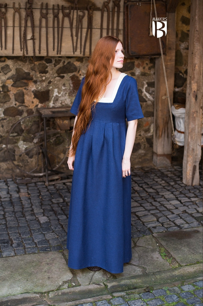 A stylish blue dress with adjustable undersleeves, designed for versatility and comfort, suitable for various occasions.
