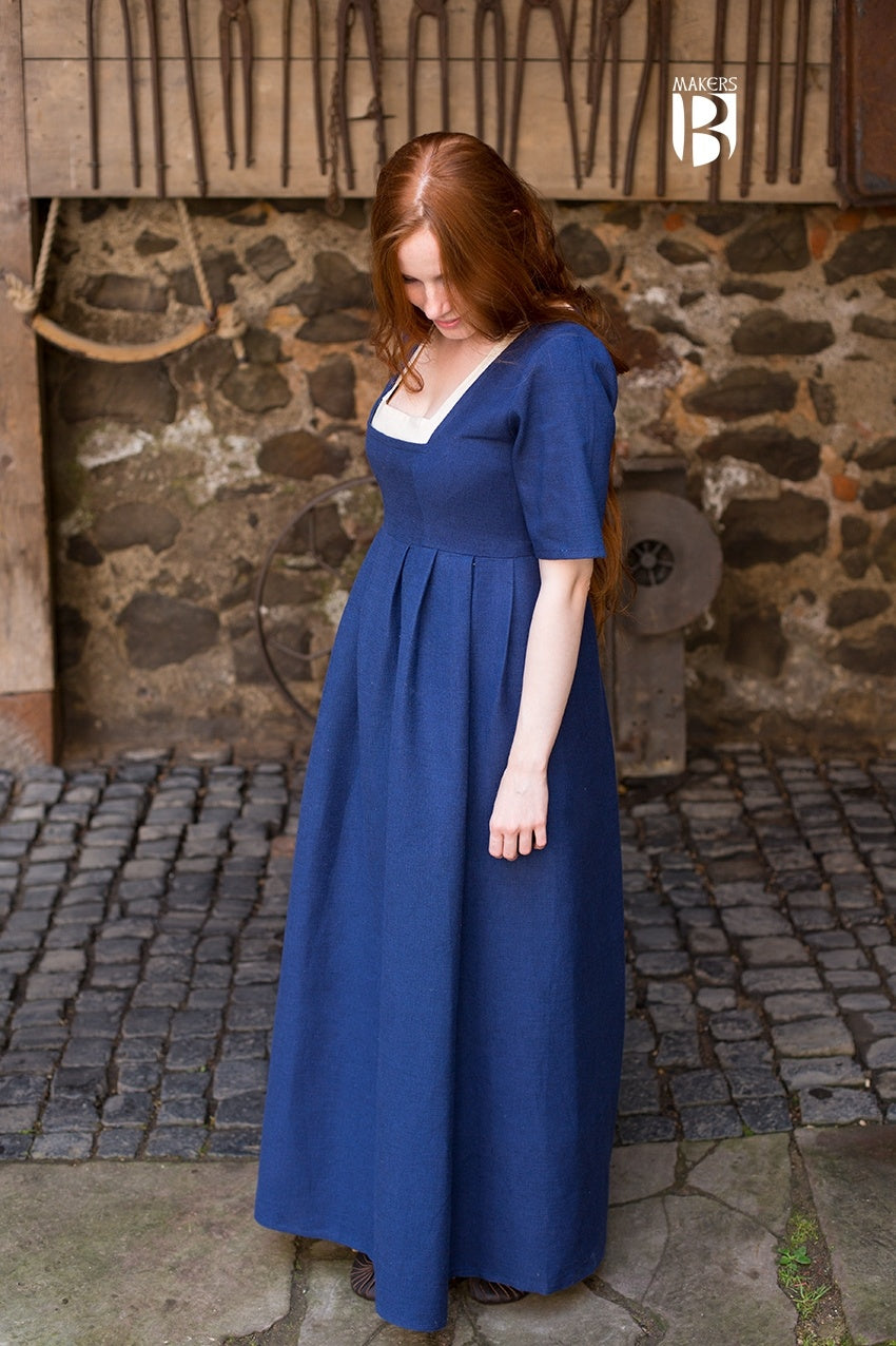 A stylish blue dress with adjustable undersleeves, designed for versatility and comfort, suitable for various occasions.