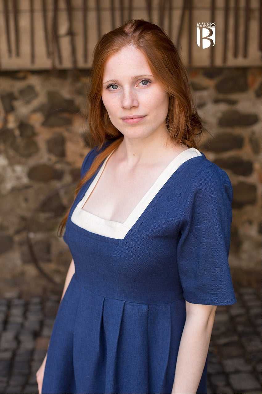 A stylish blue dress with adjustable undersleeves, designed for versatility and comfort, suitable for various occasions.