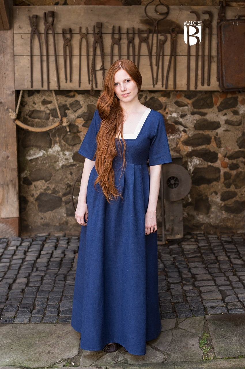 A stylish blue dress with adjustable undersleeves, designed for versatility and comfort, suitable for various occasions.