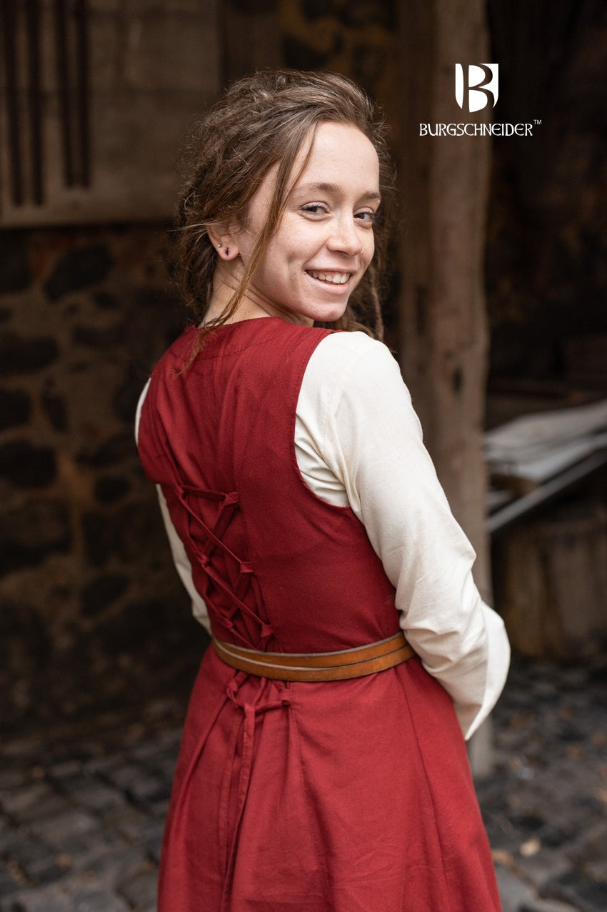 Khara Red Dress featuring a V-neckline, ornamental embroidery, and adjustable lacing in the back, made from fine cotton.