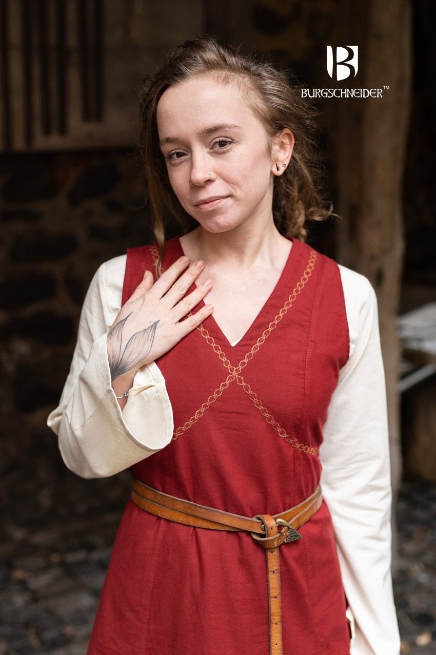 Khara Red Dress featuring a V-neckline, ornamental embroidery, and adjustable lacing in the back, made from fine cotton.