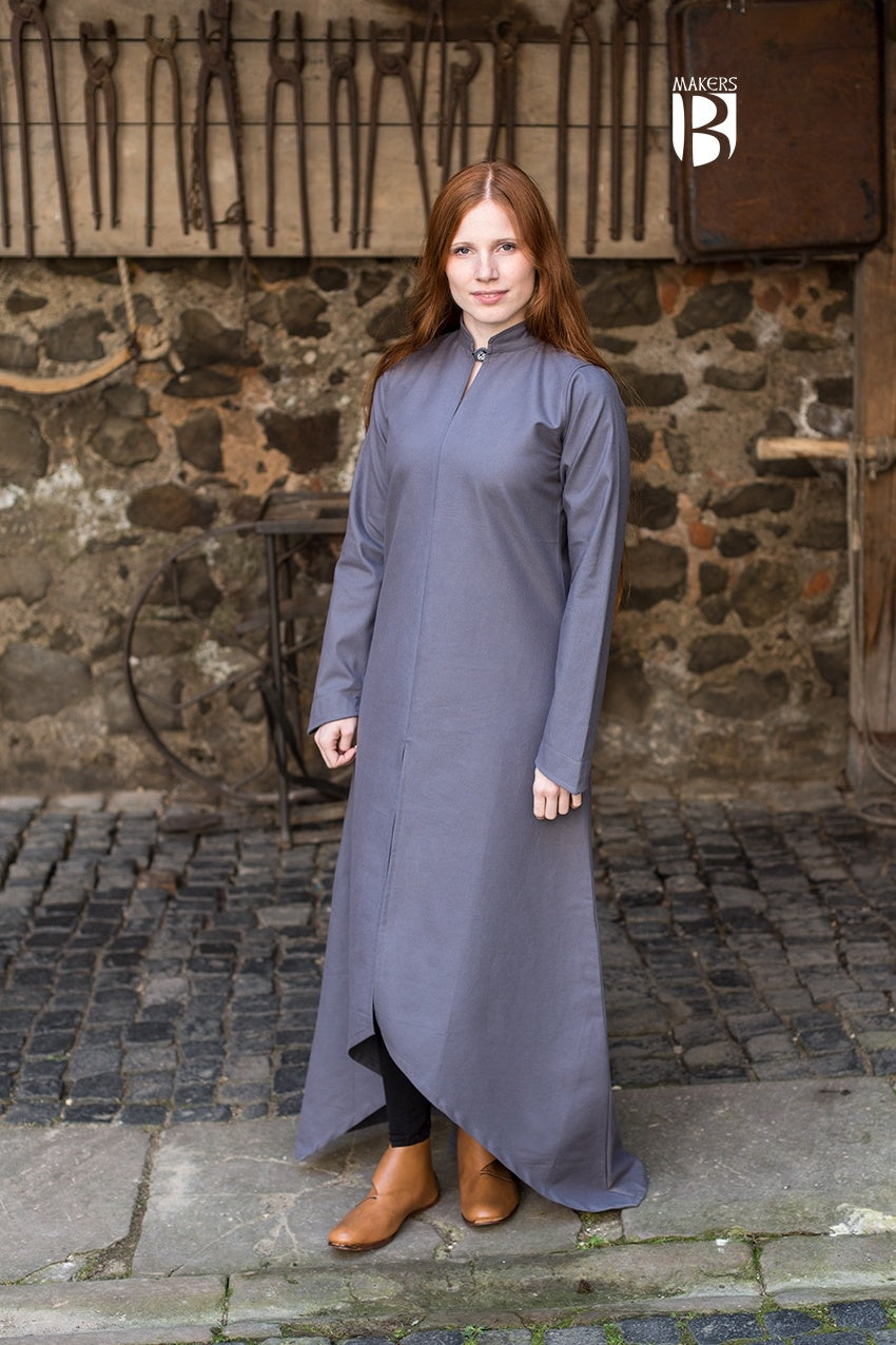 A stylish grey dress with long sleeves and a high collar, showcasing its elegant design and soft cotton fabric.