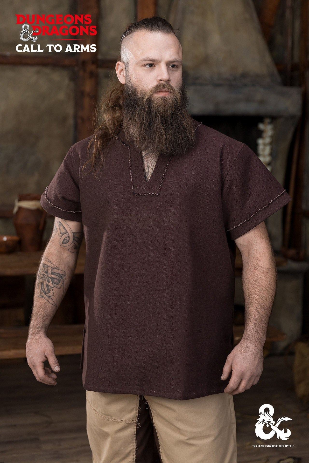 Brown Dungeons & Dragons Barbarian Shirt with short sleeves and V-neck, featuring unique bias cut trim and frayed edges.