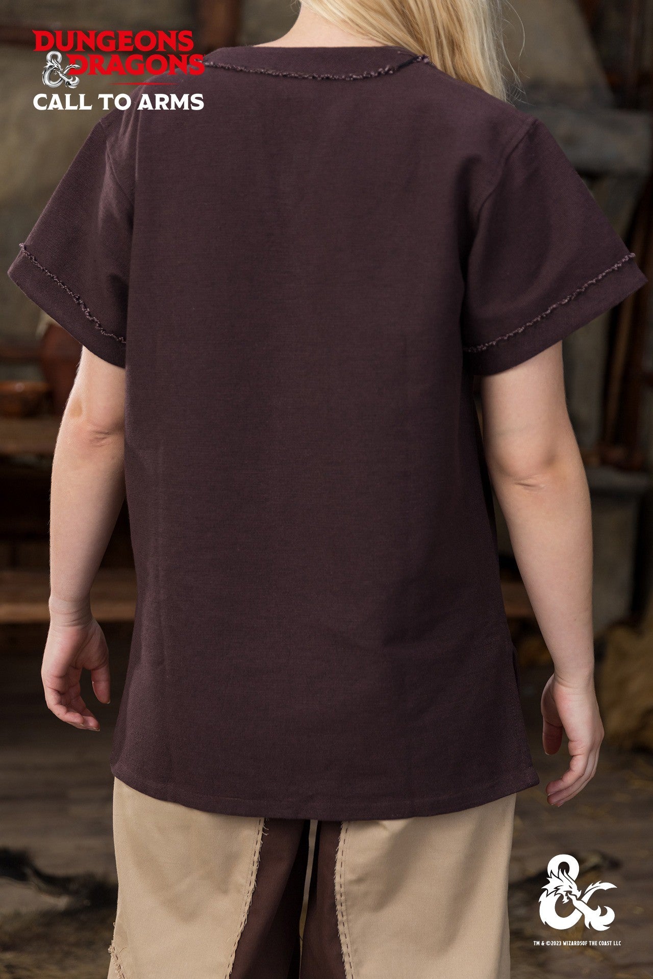 Brown Dungeons & Dragons Barbarian Shirt with short sleeves and V-neck, featuring unique bias cut trim and frayed edges.