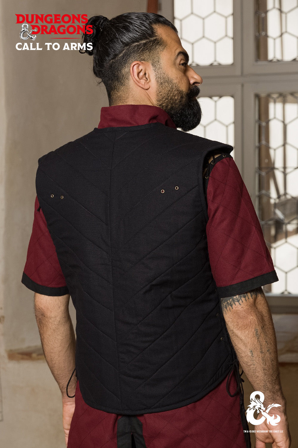 Dungeons & Dragons Fighter Vest in black, featuring quilted padding and adjustable lacing on both sides for a perfect fit.