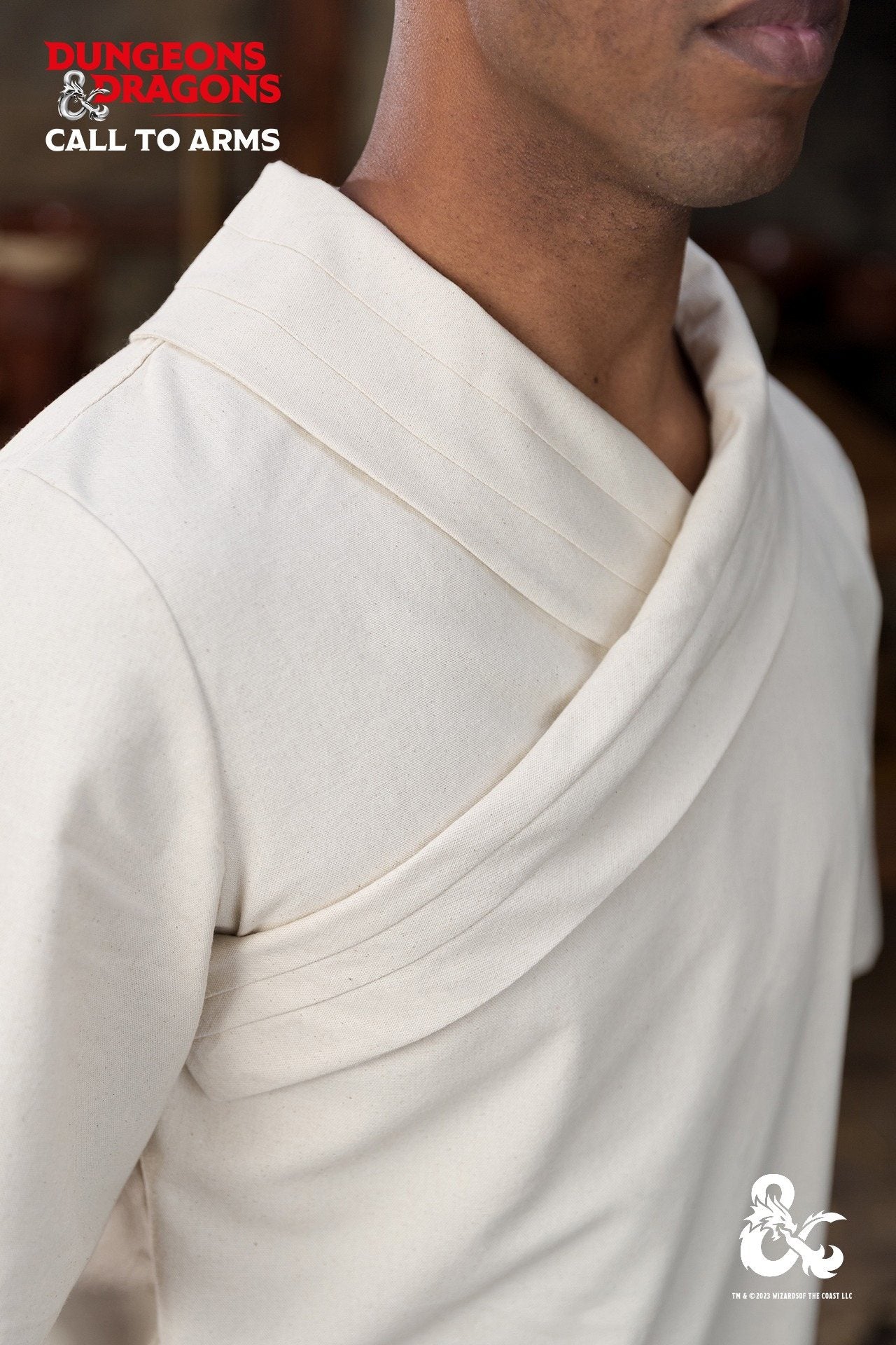 Dungeons & Dragons Monk Shirt in Natural color with short sleeves and wrapped collar, featuring side seam slits for enhanced mobility.