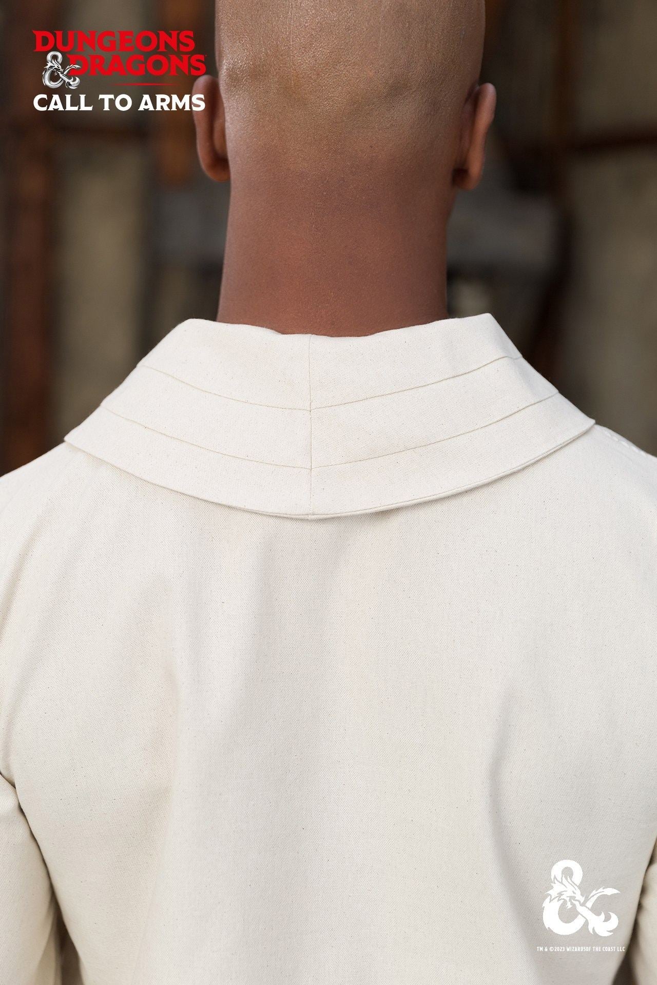 Dungeons & Dragons Monk Shirt in Natural color with short sleeves and wrapped collar, featuring side seam slits for enhanced mobility.