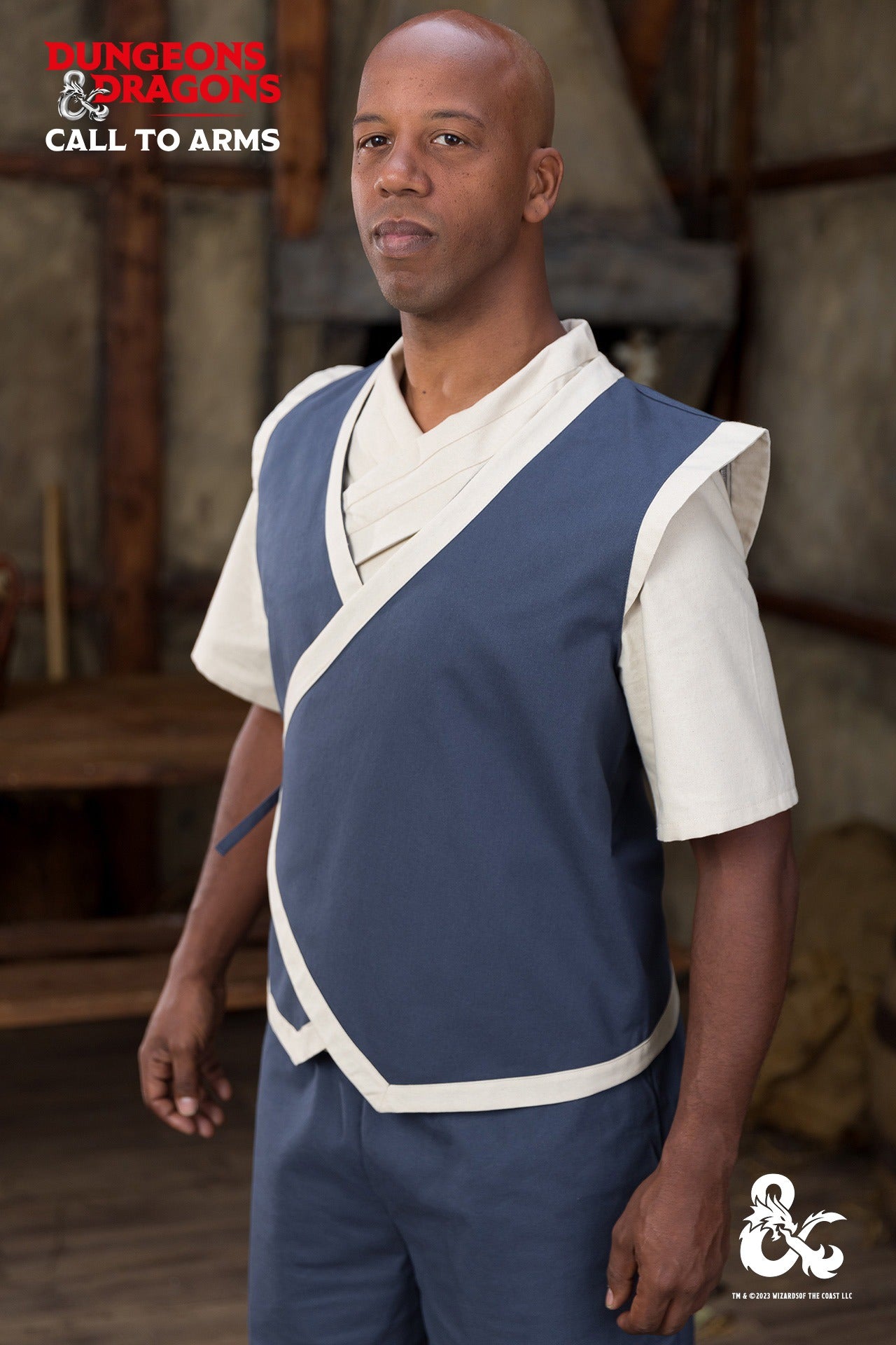Dungeons & Dragons Monk Vest in Woad Blue/Natural with wrapped front and contrast trims, perfect for role-playing and martial arts.
