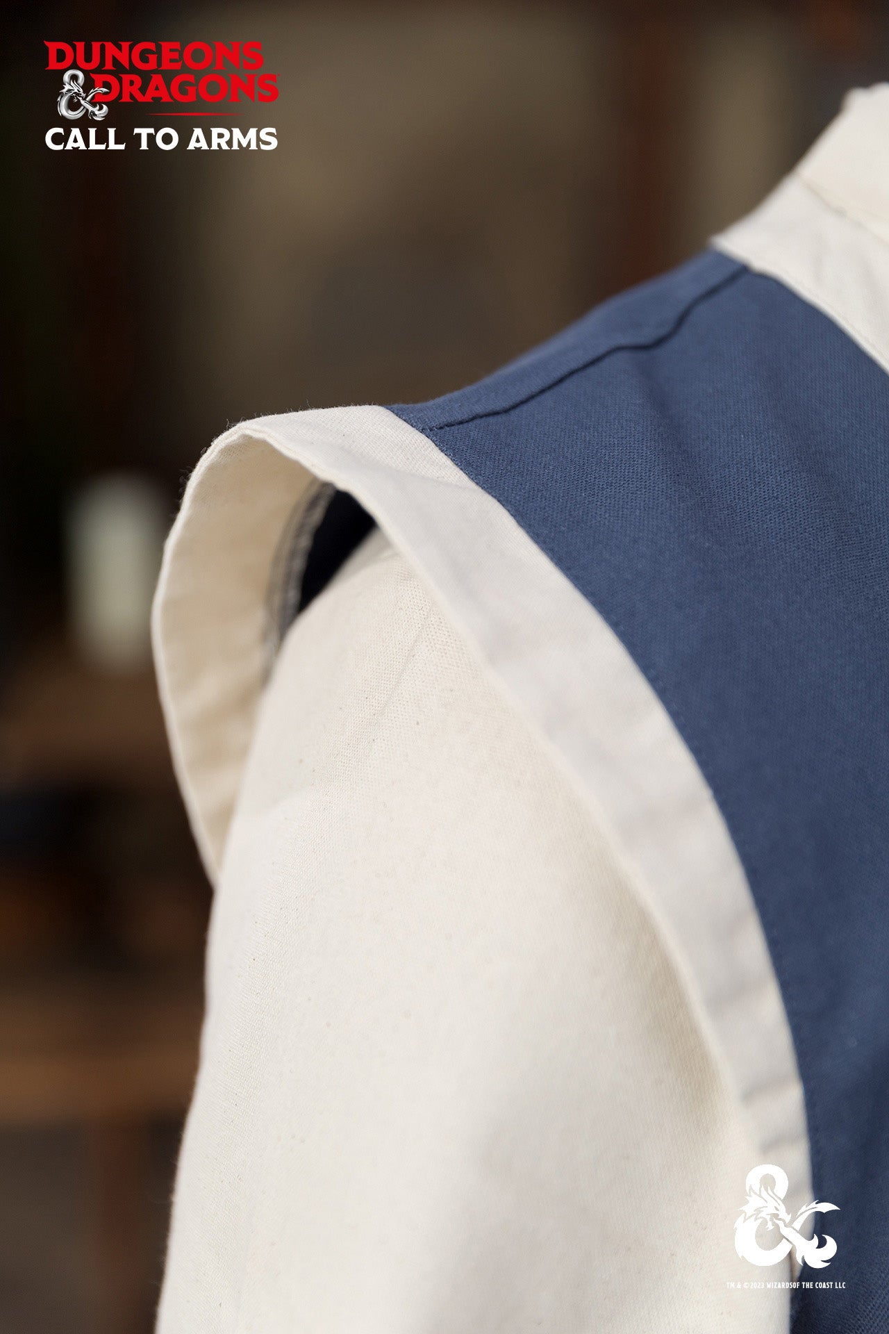 Dungeons & Dragons Monk Vest in Woad Blue/Natural with wrapped front and contrast trims, perfect for role-playing and martial arts.