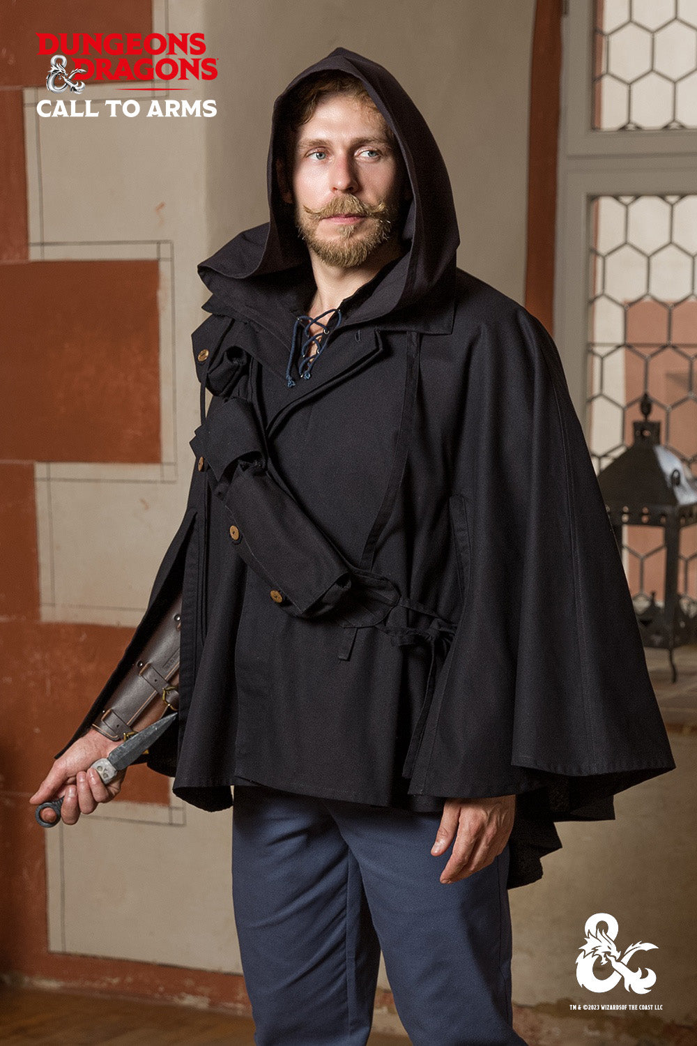 Dungeons & Dragons Rogue Cape in black, featuring a turn-over collar, drawstrings for a hood, and a hidden button pocket.