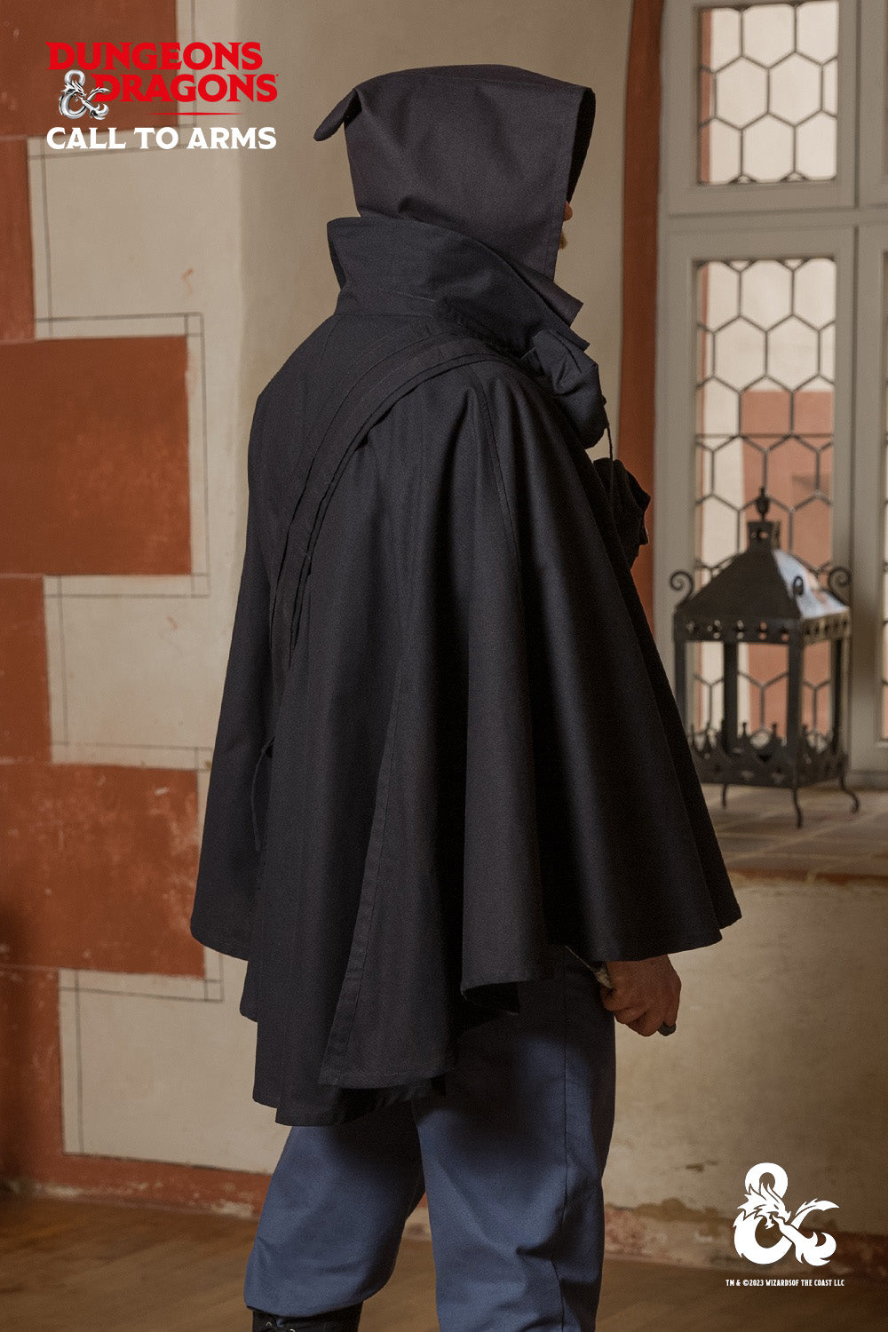 Dungeons & Dragons Rogue Cape in black, featuring a turn-over collar, drawstrings for a hood, and a hidden button pocket.