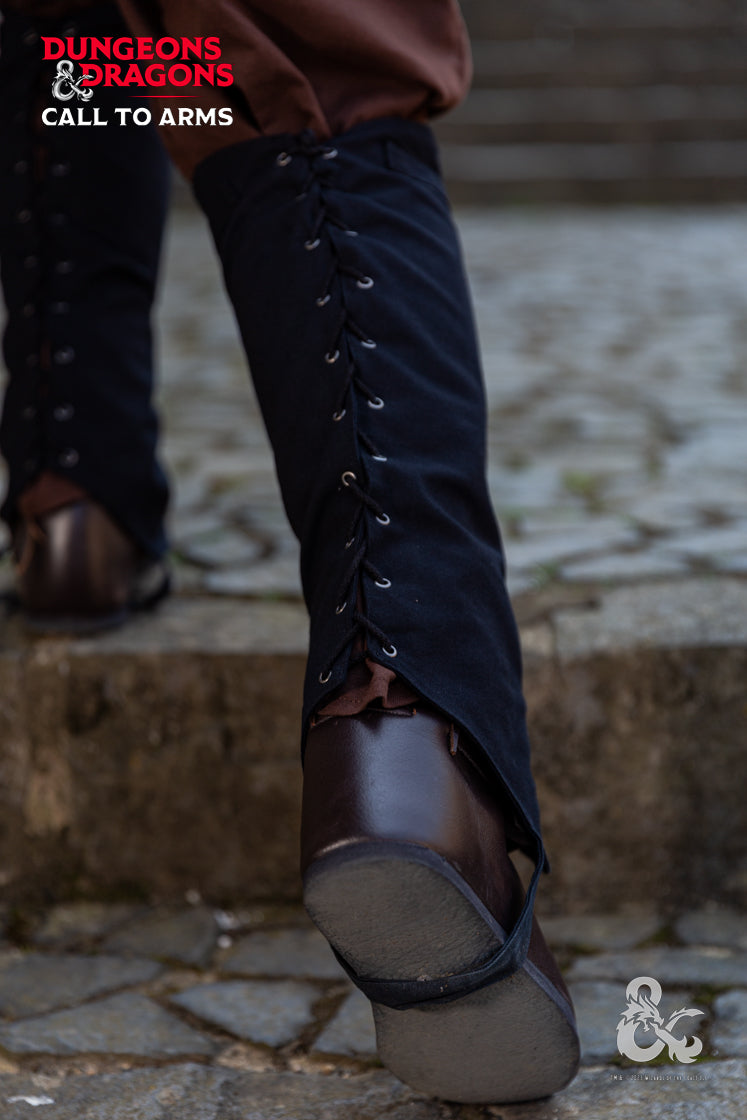 Black Dungeons & Dragons Rogue Gaiters designed for leg protection during adventures, featuring laced back and upper calf strip for weapons.