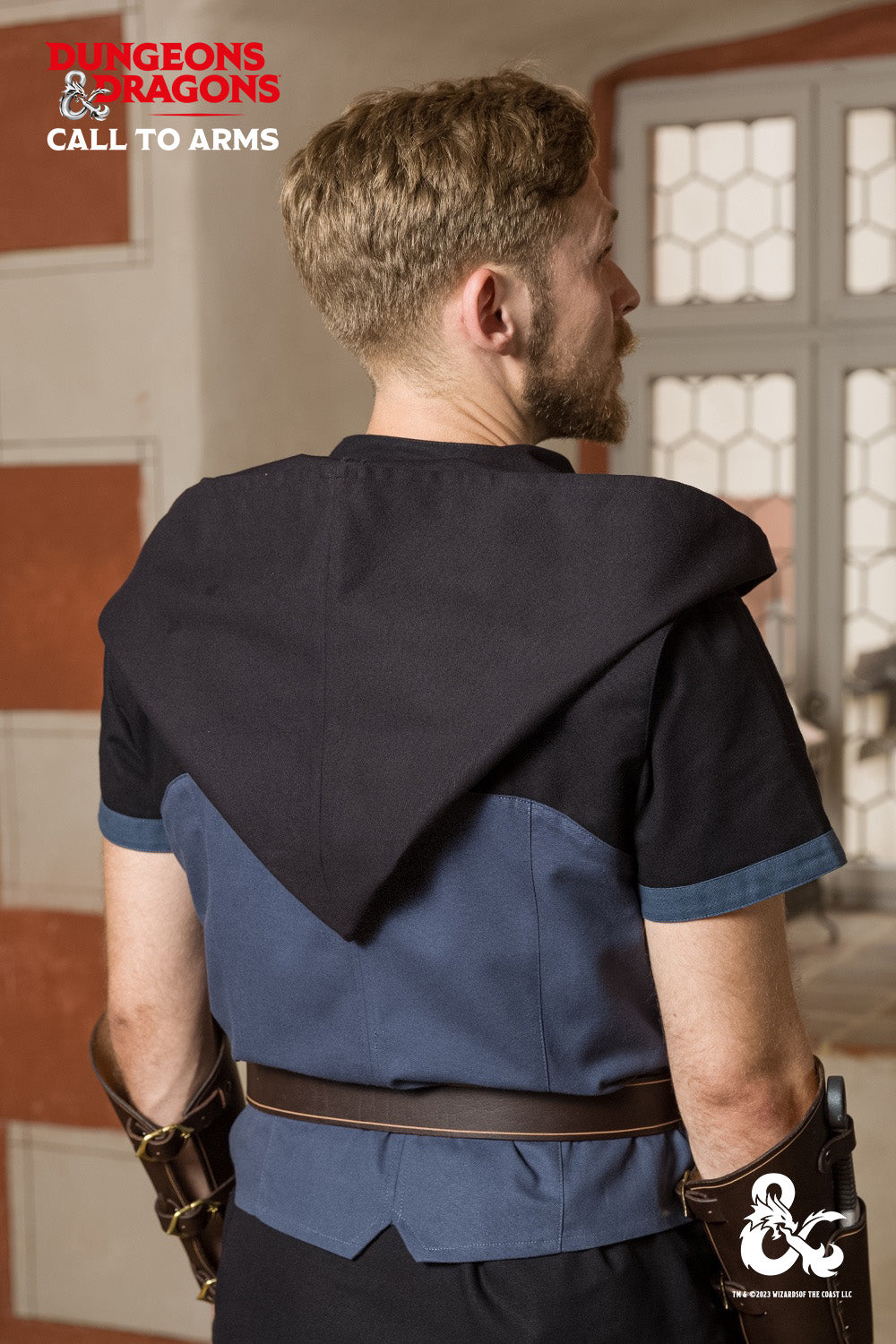 Dungeons & Dragons Rogue Hooded Vest in Woad Blue featuring a buttoned hood, contrast shoulder detailing, and a pointed hem for an edgy look.