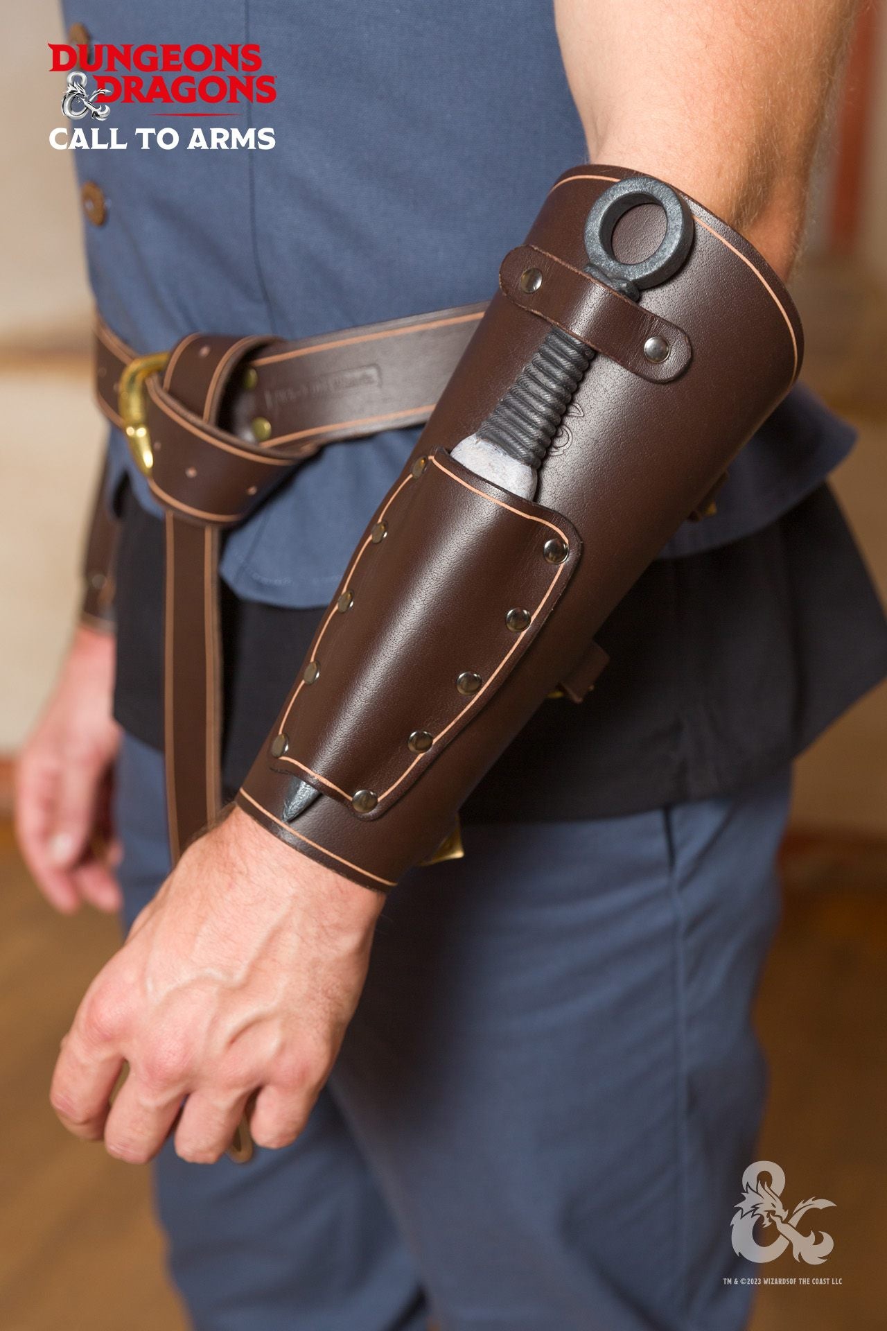 Brown leather bracers designed for Dungeons & Dragons rogues, featuring a knife compartment and elegant metal clasps.