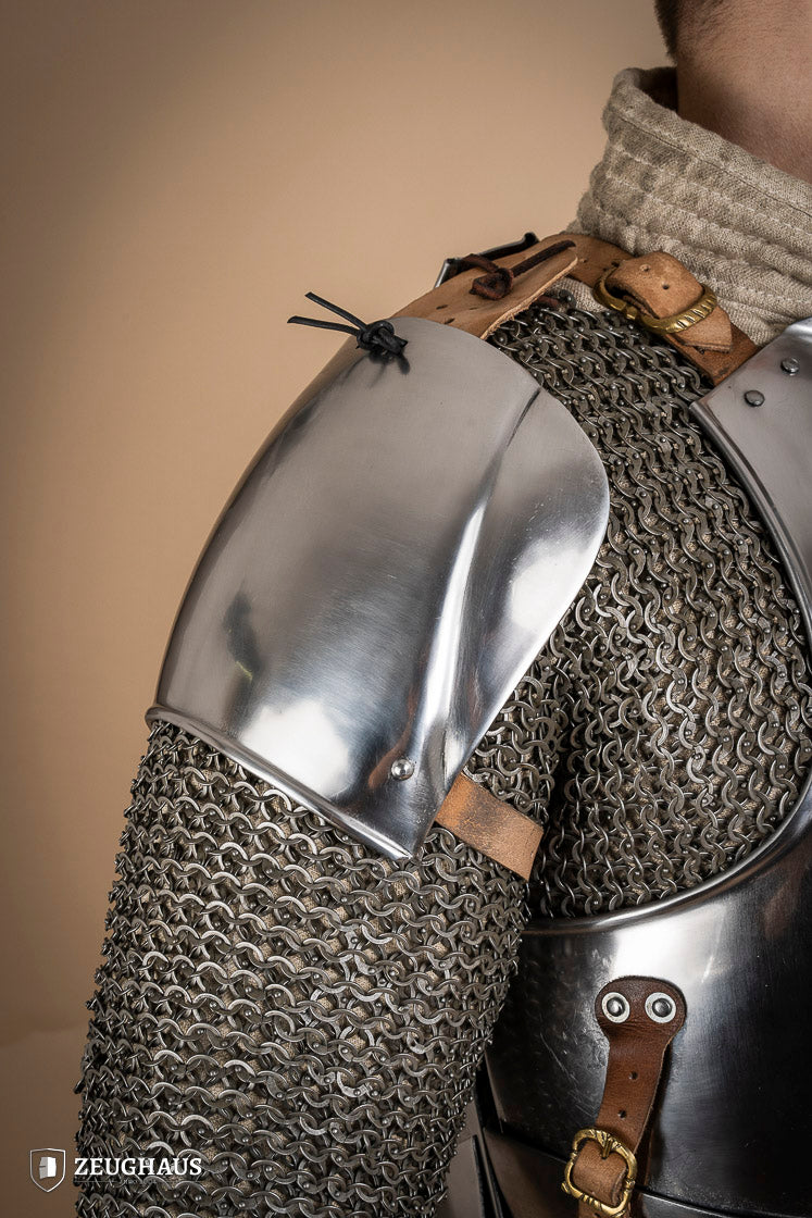 Early 15th Century Pauldrons made from 2.5mm polished steel, featuring a unique raised groove for enhanced mobility and protection.