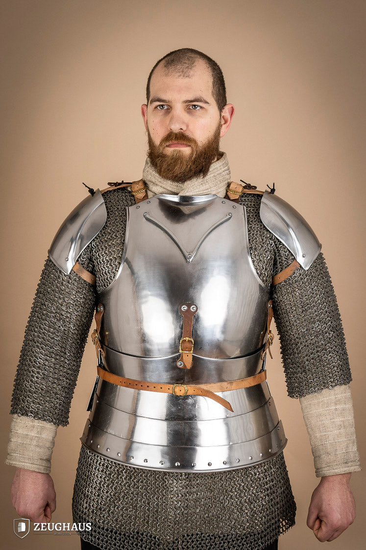 Early 15th Century Pauldrons made from 2.5mm polished steel, featuring a unique raised groove for enhanced mobility and protection.