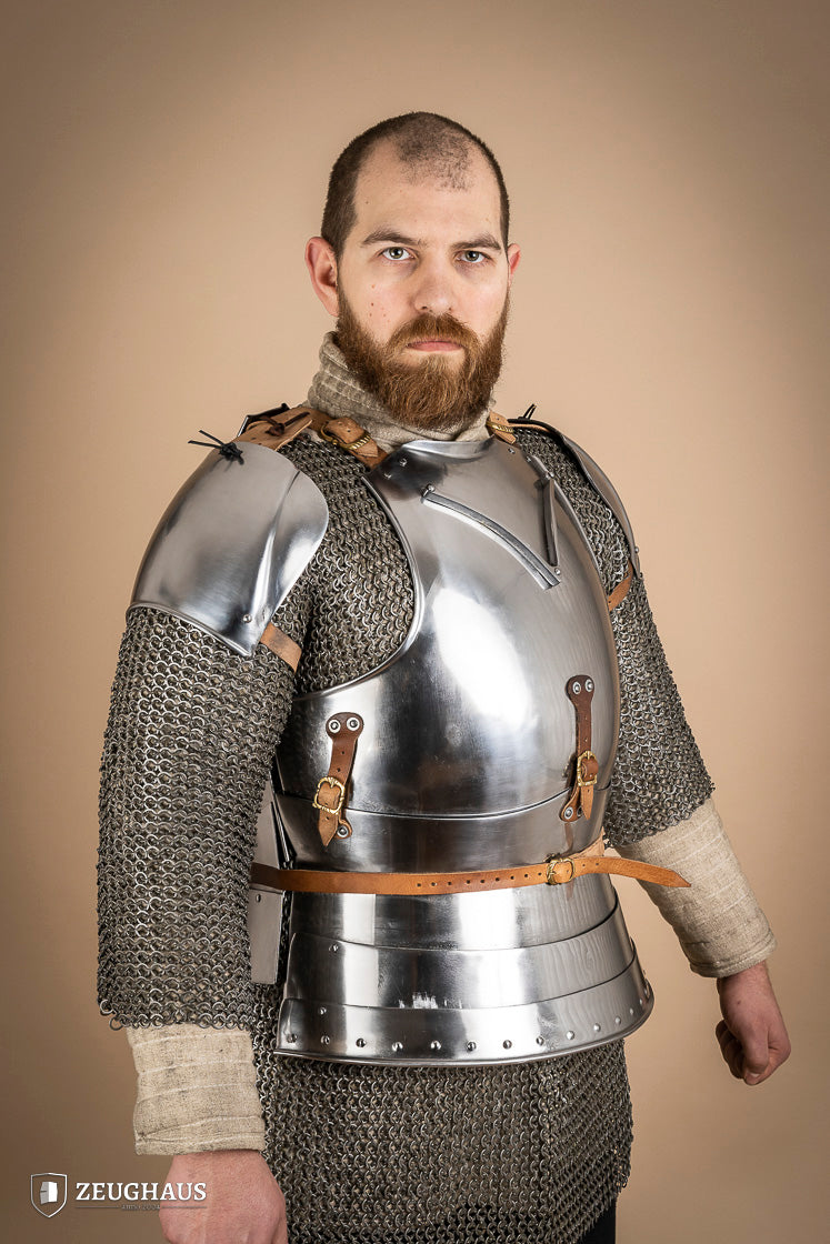 Early 15th Century Pauldrons made from 2.5mm polished steel, featuring a unique raised groove for enhanced mobility and protection.