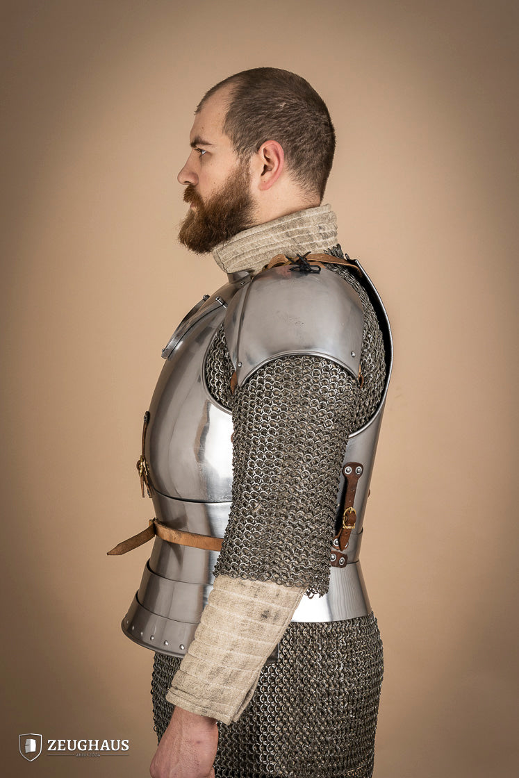 Early 15th Century Pauldrons made from 2.5mm polished steel, featuring a unique raised groove for enhanced mobility and protection.