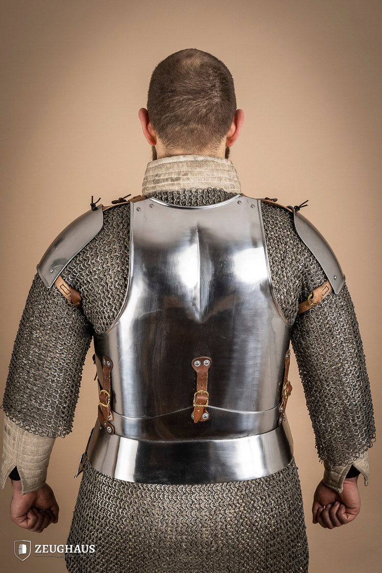 Early 15th Century Pauldrons made from 2.5mm polished steel, featuring a unique raised groove for enhanced mobility and protection.