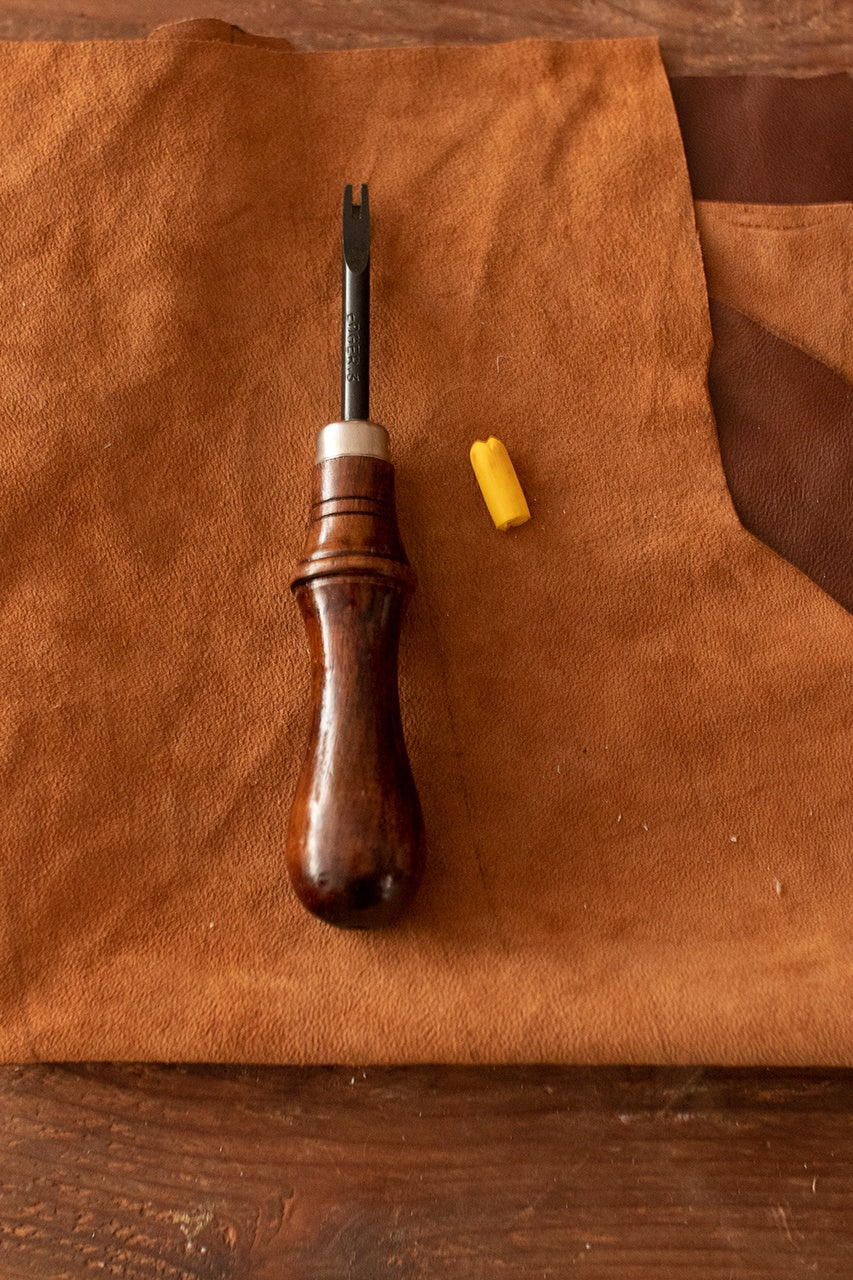 Edge Beveler with a 2 mm blade and rosewood handle, designed for smoothing leather edges.