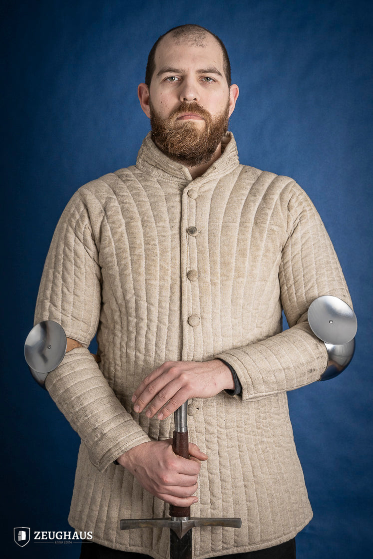 Polished 1.6mm steel elbow caps showcasing craftsmanship and durability.