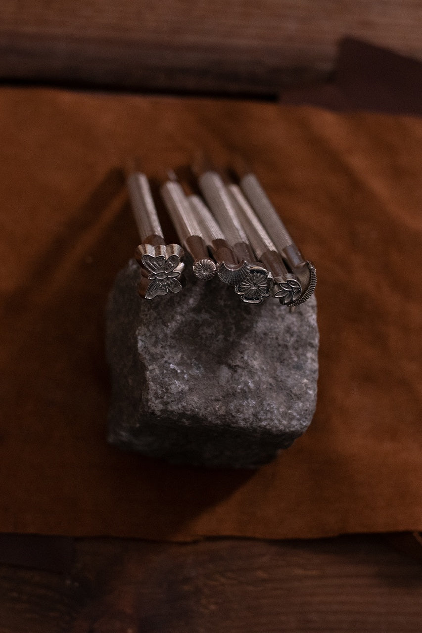 A 7-part Embossing Tool Set made of durable iron, designed for personalizing leather crafts with various shapes and sizes.