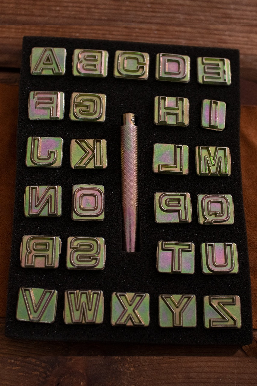 Embossing Tool Set Alphabet BLOCK featuring 26 iron stamps and one handle, ideal for personalizing leather projects.