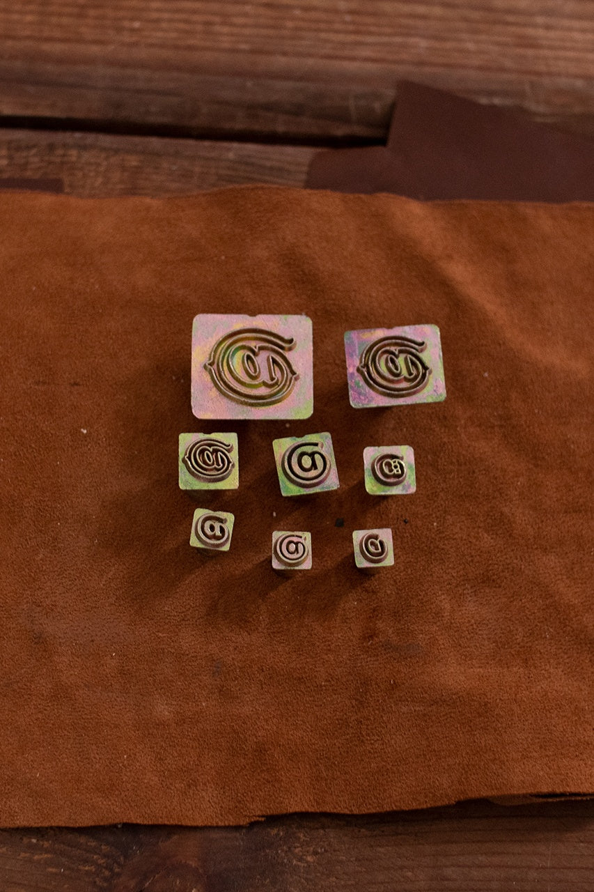 Embossing Tool Set featuring 8 iron stamps in various sizes for leather crafting.