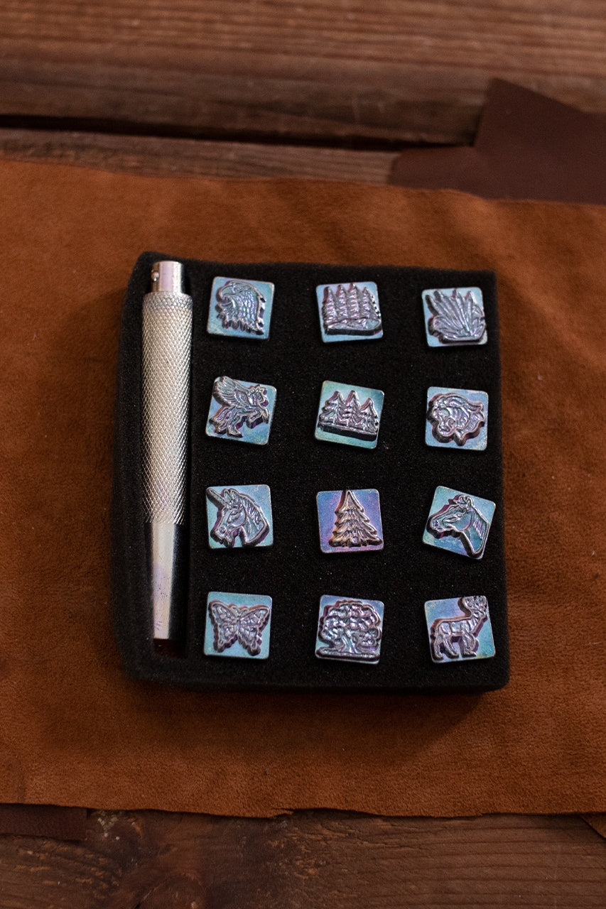 Mini Embossing Tool Set featuring 12 iron stamps and an iron handle for leather crafting.
