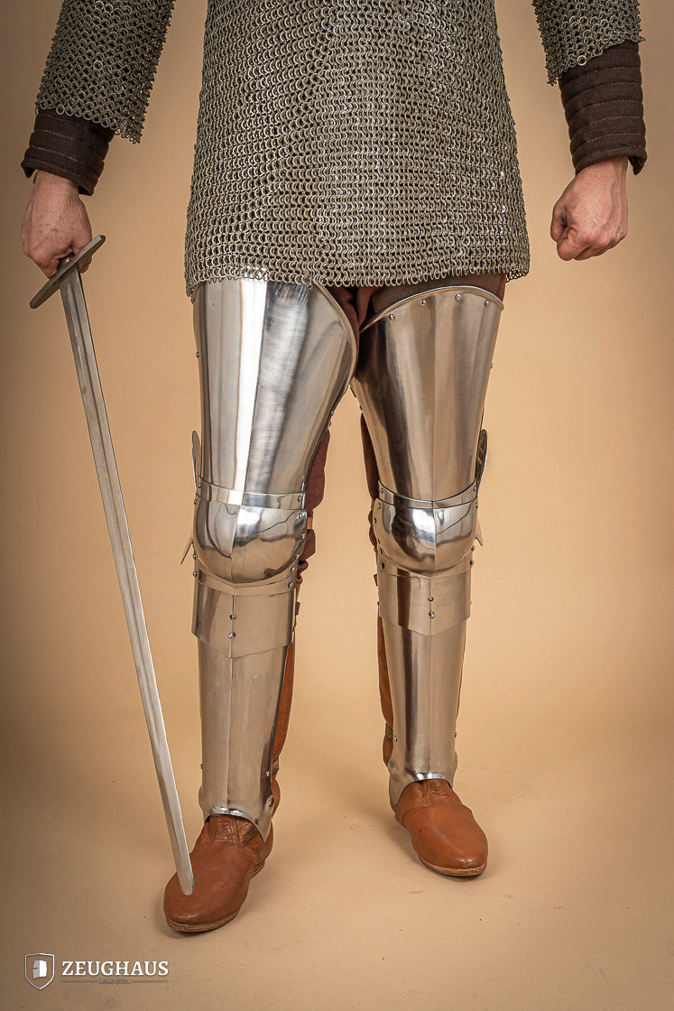 Full Leg Armour made of 1.6 mm polished steel with adjustable knee joints, featuring a satin finish and brass buckles.