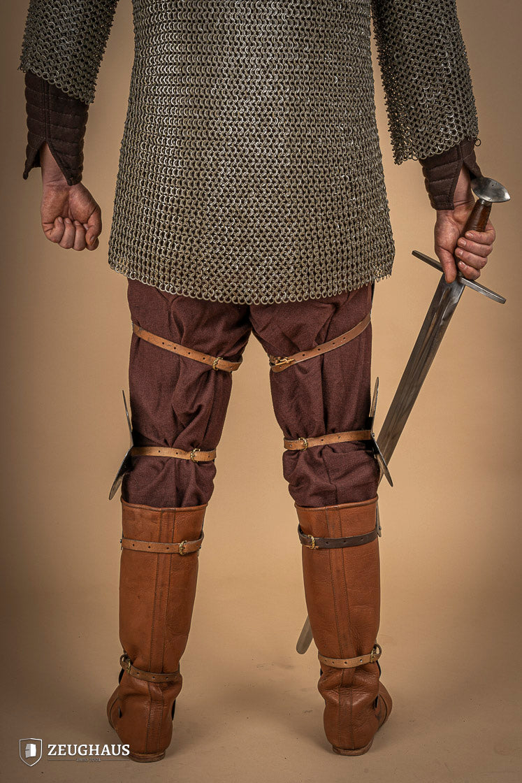 Full Leg Armour made of 1.6 mm polished steel with adjustable knee joints, featuring a satin finish and brass buckles.